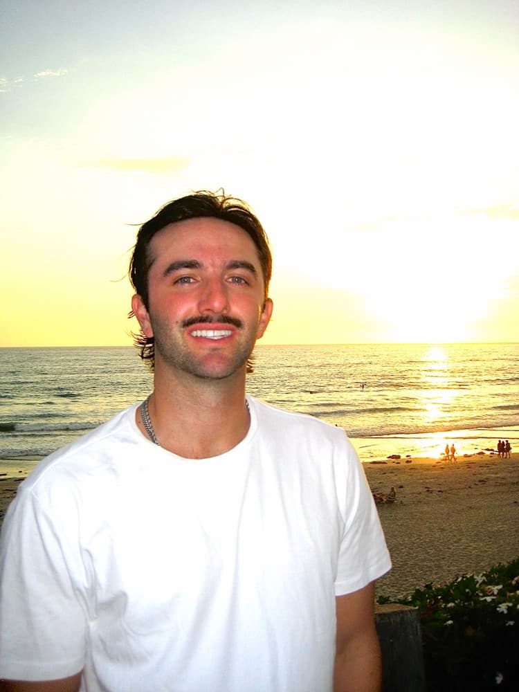 Blake McDonald at the beach at sunset